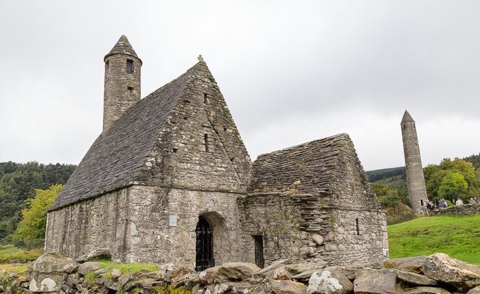 Historic stone church and round tower at Glendalough Monastic Site in County Wicklow